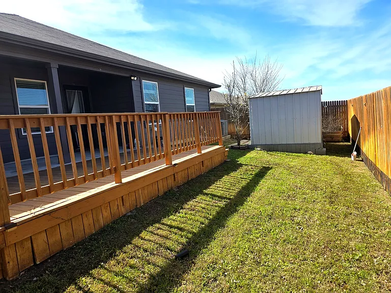 Private fenced backyard with plenty of space for outdoor living.