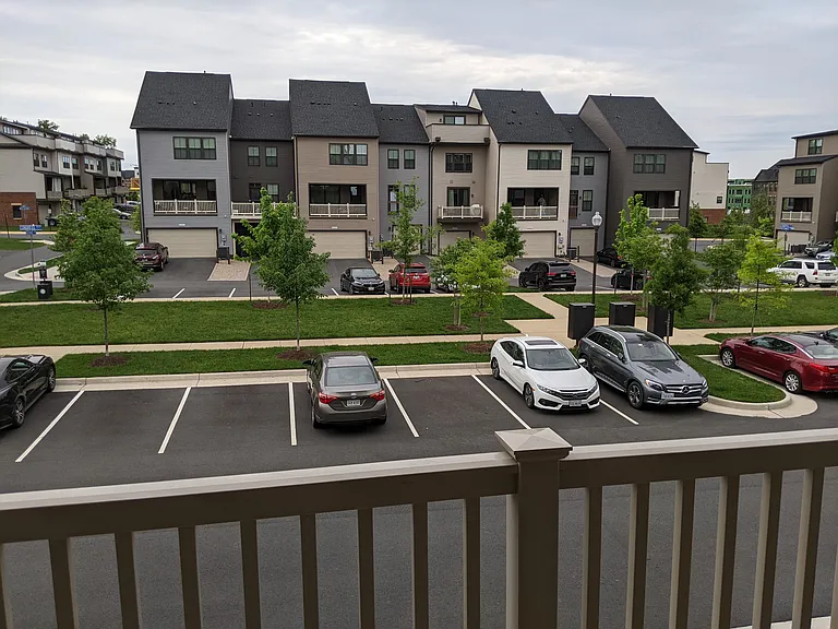 Balcony off of living area--more green space and extra parking