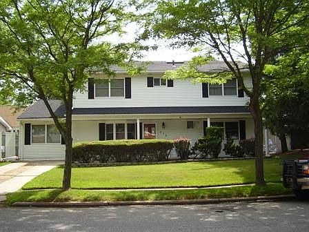 Beautiful broadside Colonial Situated on Tree Lined Street