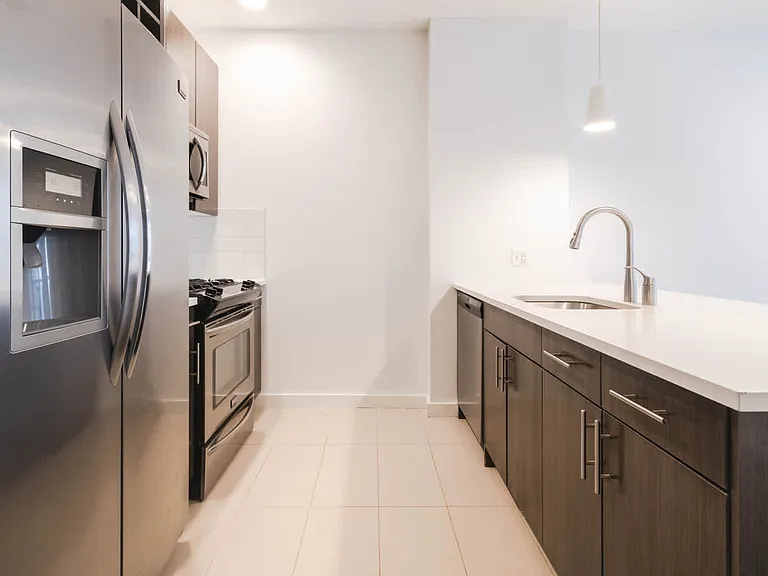Kitchen with Quartz Countertops and Stainless Steel Appliances
