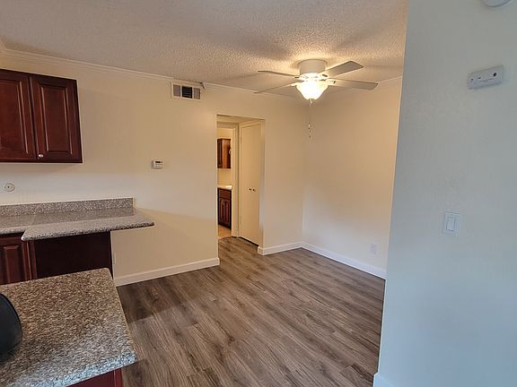 from the living room into dining area the towards the bathroom