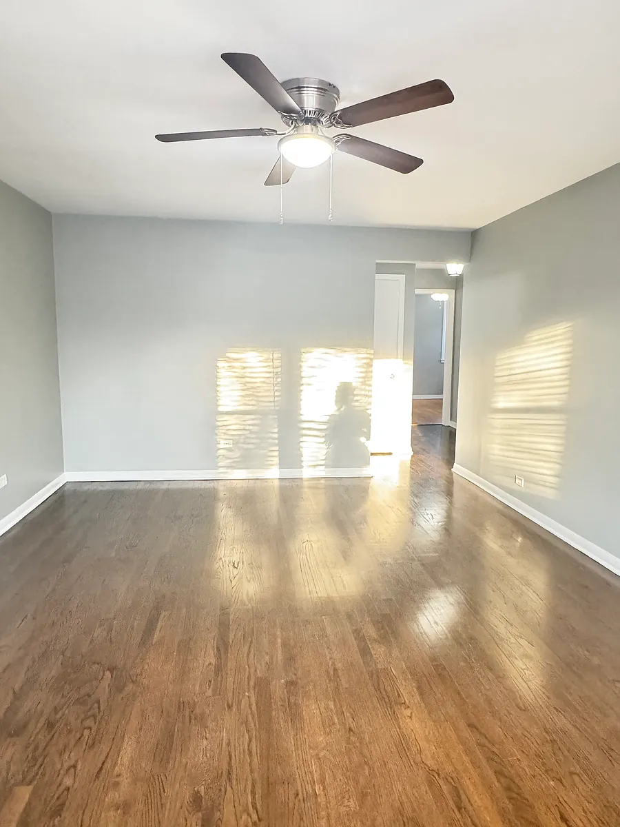 LIVING ROOM WITH CEILING FAN - 2441 N Lowell Ave #2