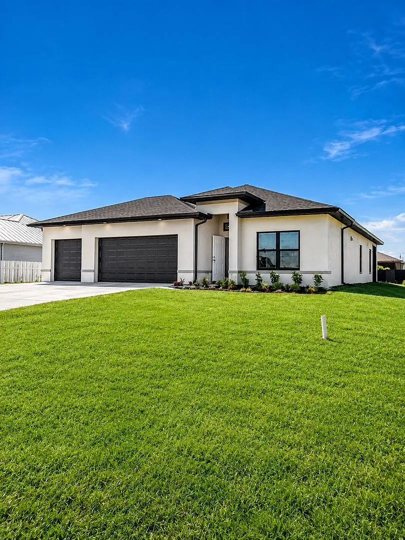 Brand-New Luxury Home with 3-Car Garage & Lawn Care Included | Modern Living in Cape Coral! — Photo 2