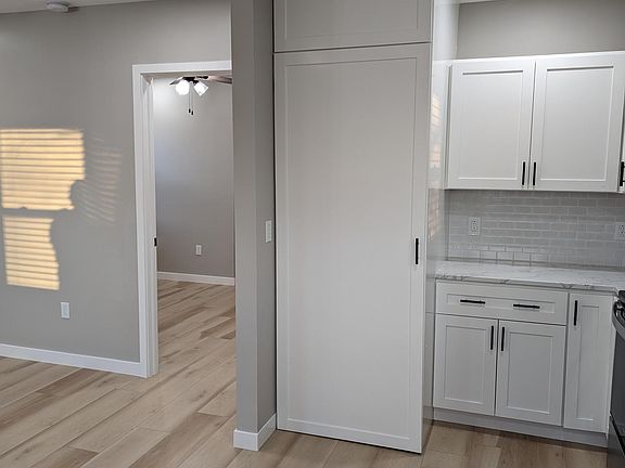 Kitchen corner next to refrigerator