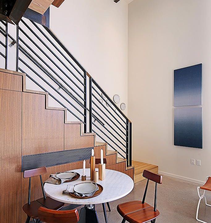 Partial- and full-blackout blinds are electronically controlled at the base of the stairs.