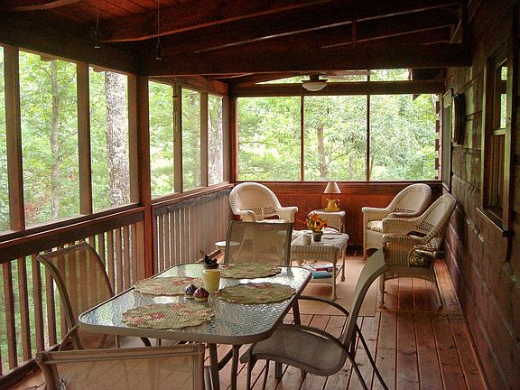 Beautiful screened in porch backs to the woods