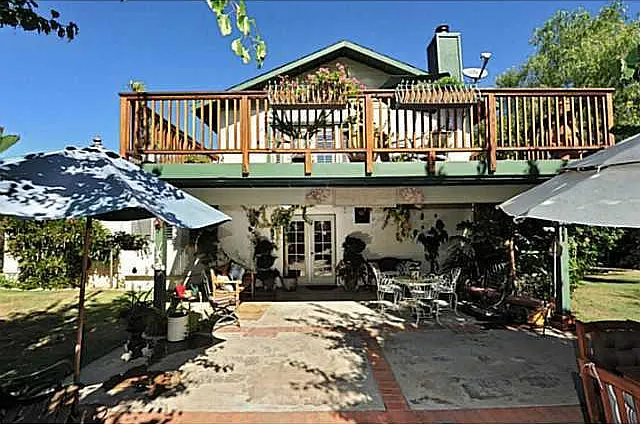 back of home patio and upstairs deck
