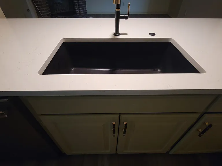 Brand new large, deep granite composite sink with coordinating faucet. Great for washing large pots or vegetables.