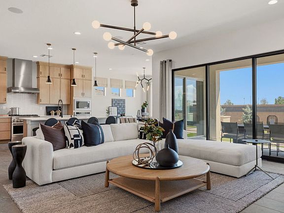 Spacious interior gathering room and kitchen plus gorgeous dining room.