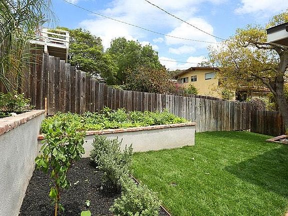 Yard with communal vegetable garden