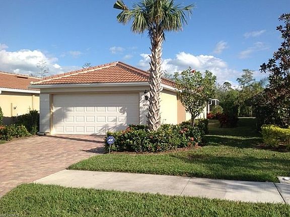 Villa features a two car garage with storage.