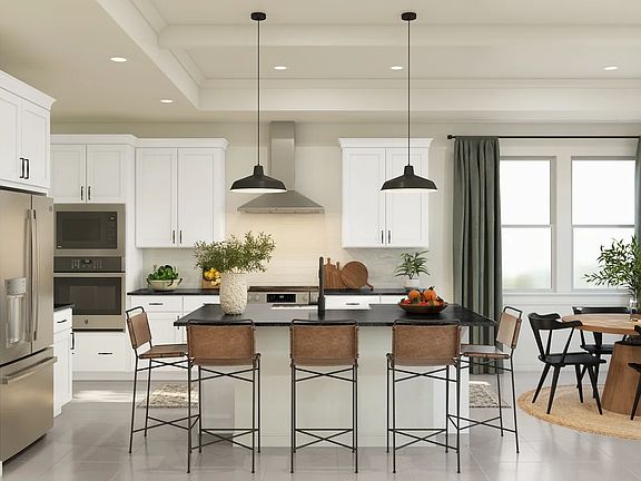 Kitchen with tray ceiling, ceiling beams and pendant lighting