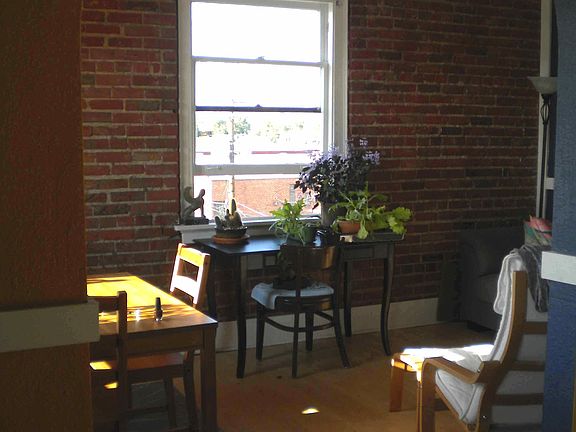 Living room with exposed brick walls