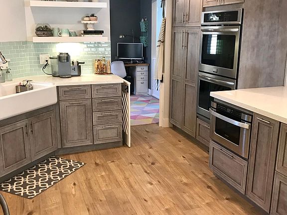 Double oven, large apron sink, drawer microwave, built in garbage and recycling. All appliances included