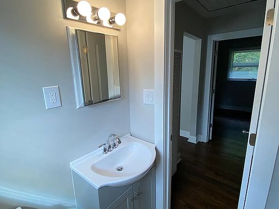 Bathroom looking towards the bedroom and hallway.