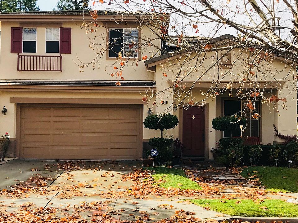 Front view with 2 car garage and front lawn, landscaping paid for by owner