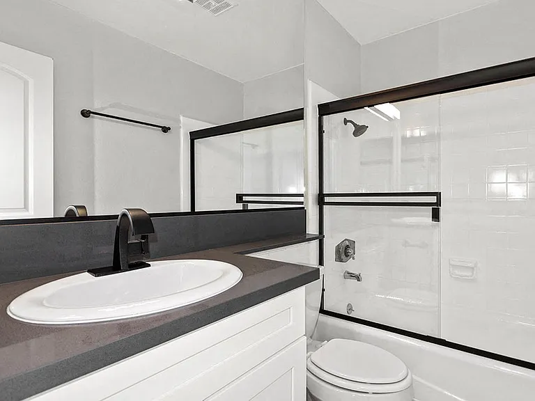 Modern styled bathroom with shower and tub.