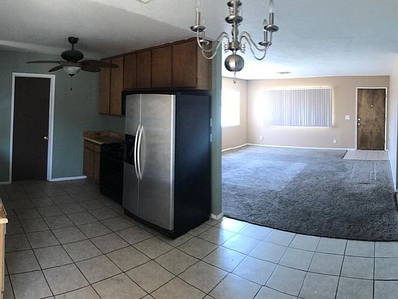 Large kitchen with door to attached garage