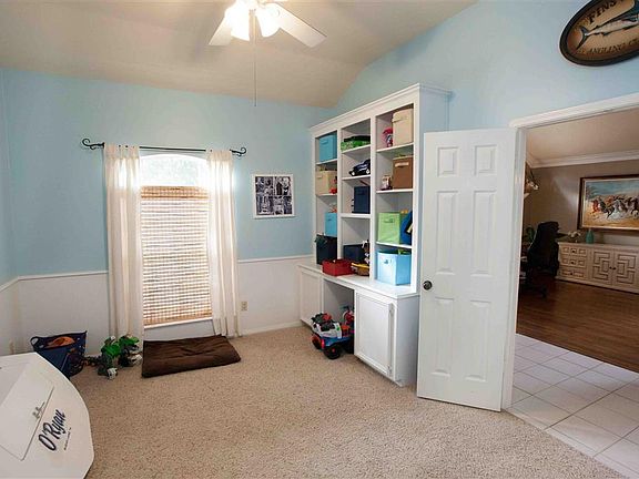 Study with built-ins now being used as pay room.  Could be 4th bed room with closet.
