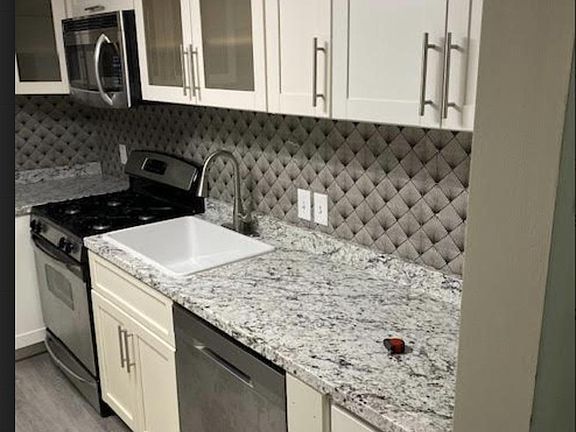 Kitchen: stainless steep applianced, fridge: water, ice, dishwasher, LED color changing, kitchen fan: light, farmers sink