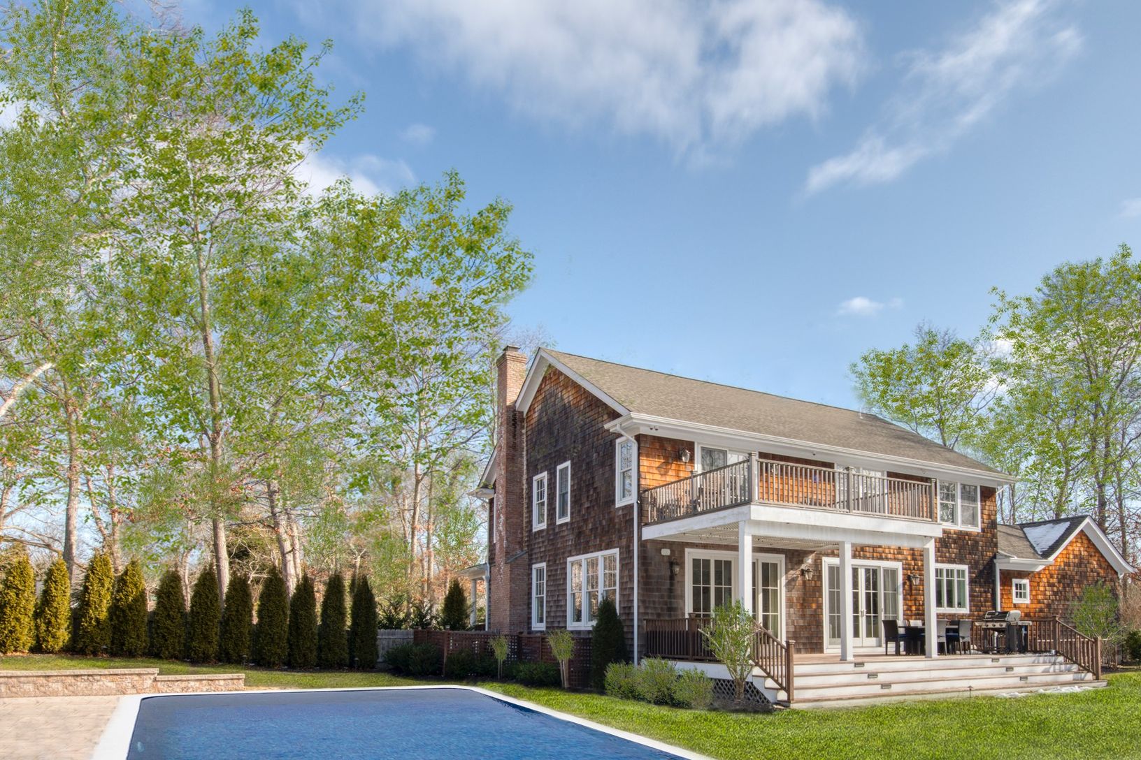  spacious backyard with heated pool, firepit and putting green