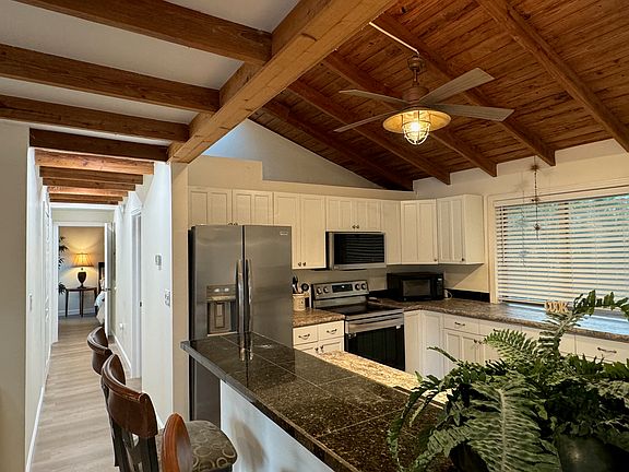 Open Kitchen w/ new modern appliances & skylight.