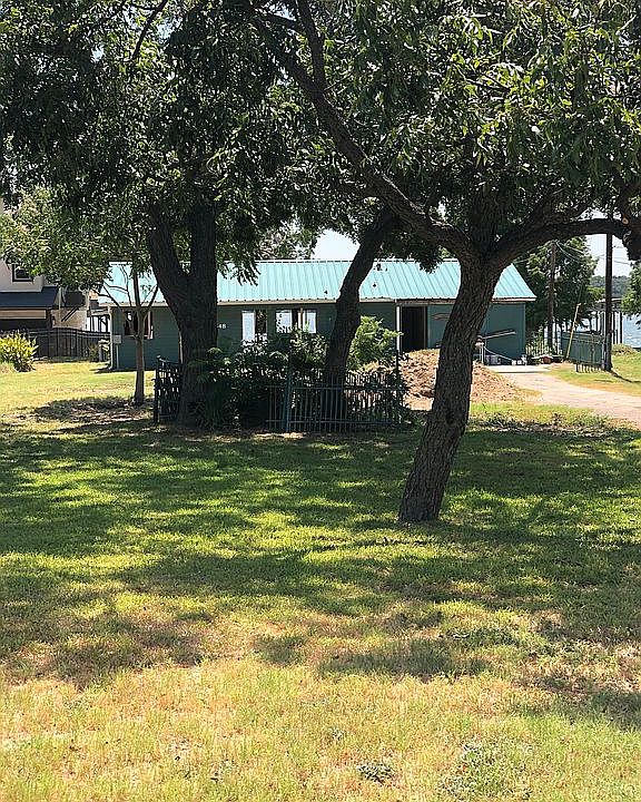 Front view, large shaded lot