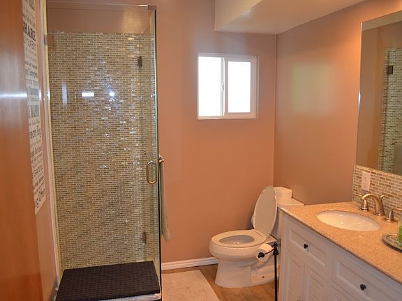 Remodeled bath w/ glass tile