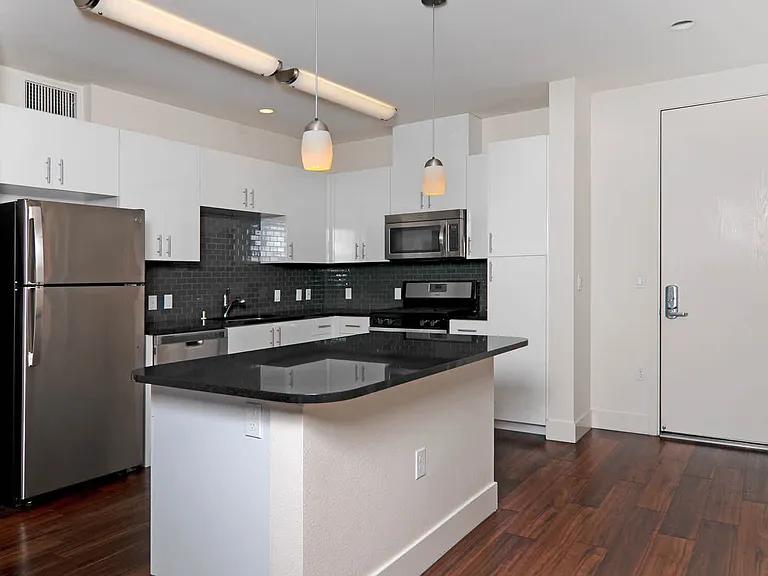 Kitchen with Breakfast Bar and Stainless Steel Appliances