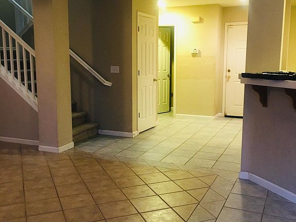 Entrace, staircase on left, nook and kitchen on the right