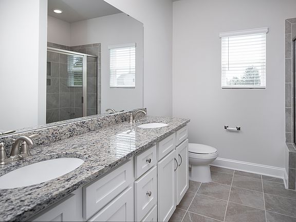 Every bathroom has plenty of space and granite countertops