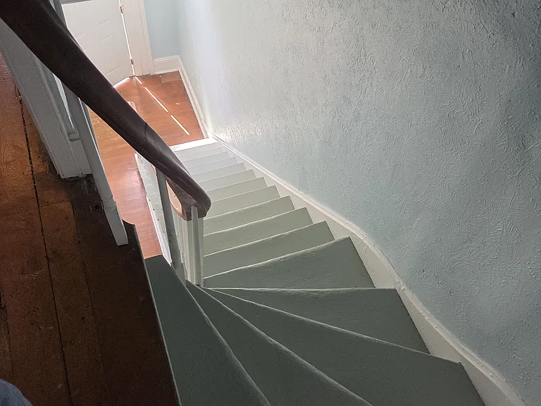 Stairs from foyer to entry door