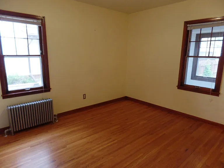 Back Bedroom. Window on the right leads into Three Season Porch.