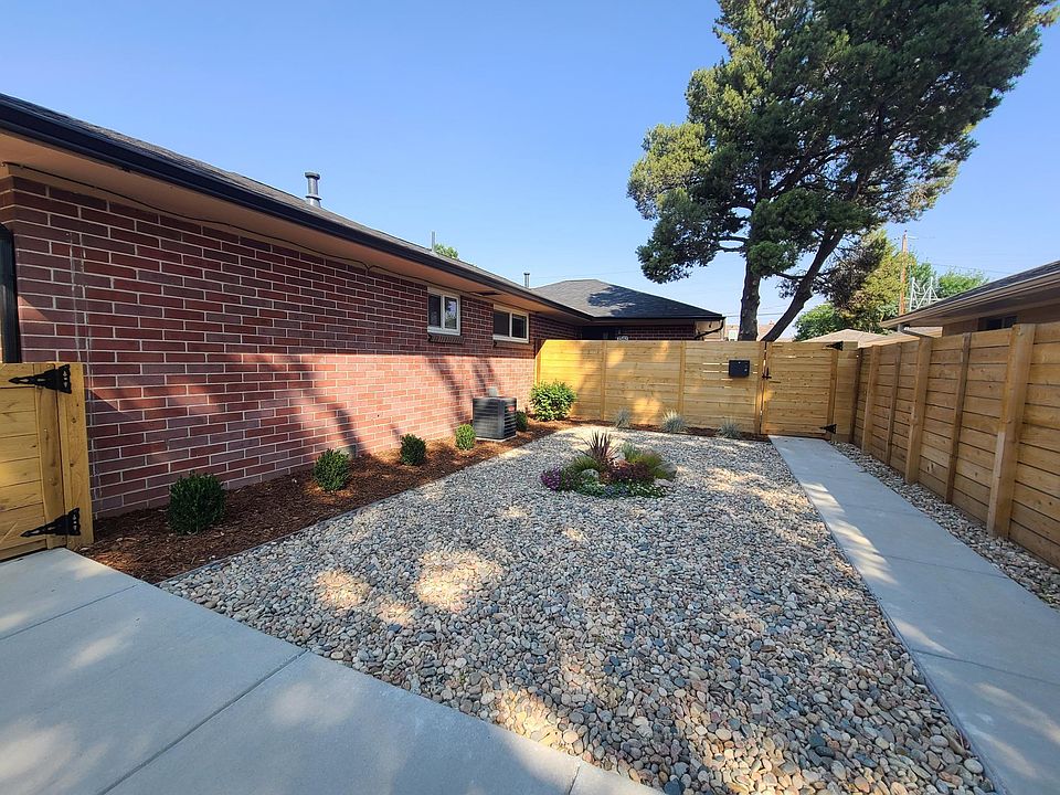 Entrance to unit through gate, mailbox on outside of fence. Unit set back from street, nice and quiet.