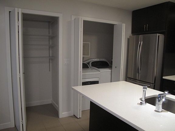 HE washer and dryer. Pantry for additional storage.