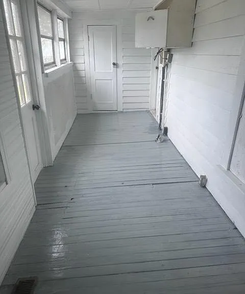 Back porch is perfect for a freezer or storage and is climate controlled