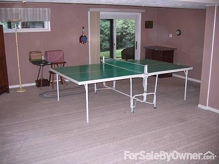 Recreation room two steps up from garage
						:
						Lots of room to play. Has fireplace for gas or wood.