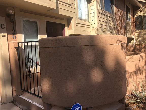 Front door entrance with gate and door code