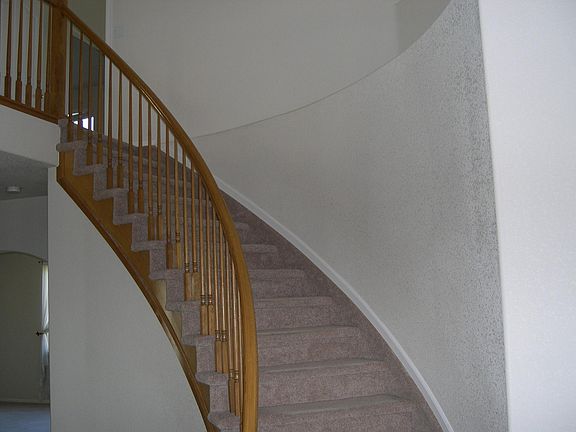 Entry w/curved stairs