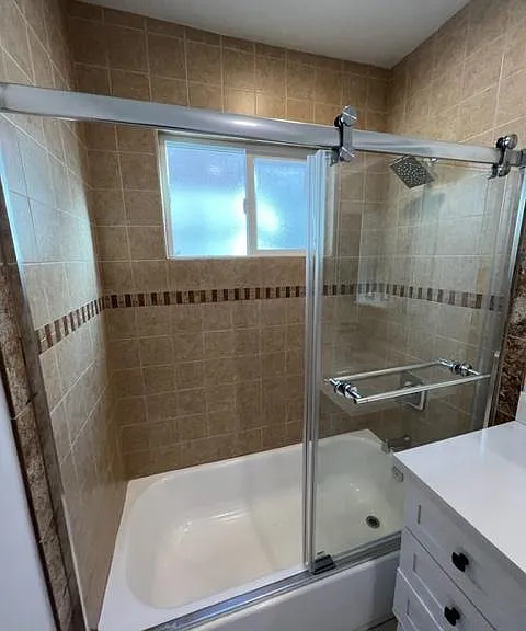 Bathroom #2 with glass enclosure.