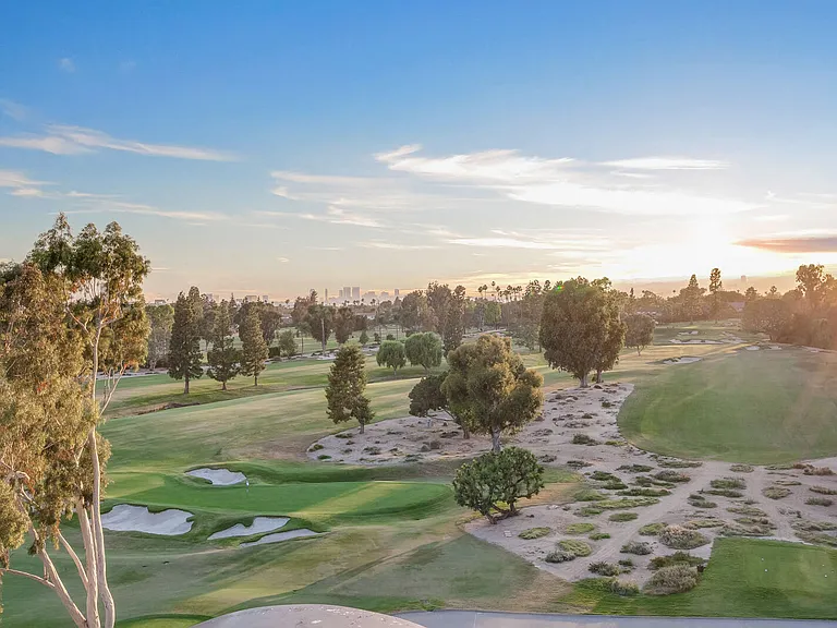 Bordered by the greens of the Wilshire Country Club