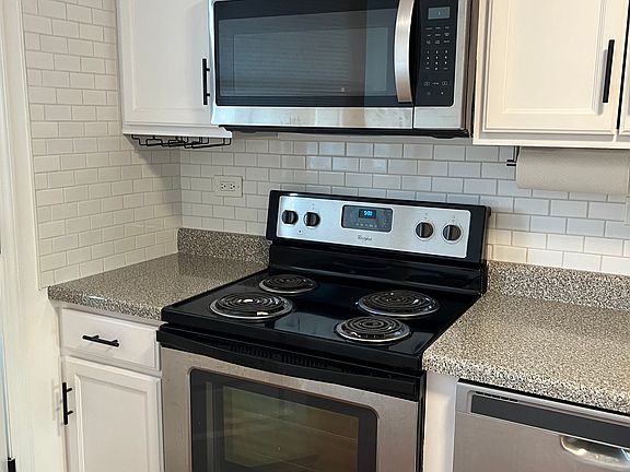 Newer stainless steel appliances with electric stove