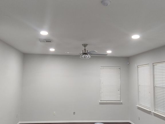 living room with recess lighting and ceiling fan