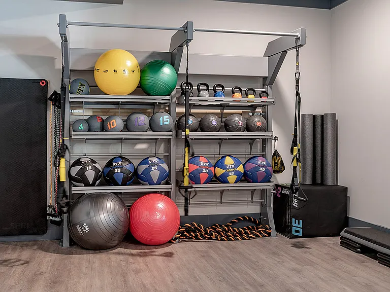 Elevate your fitness routine with this well-equipped apartment gym corner.