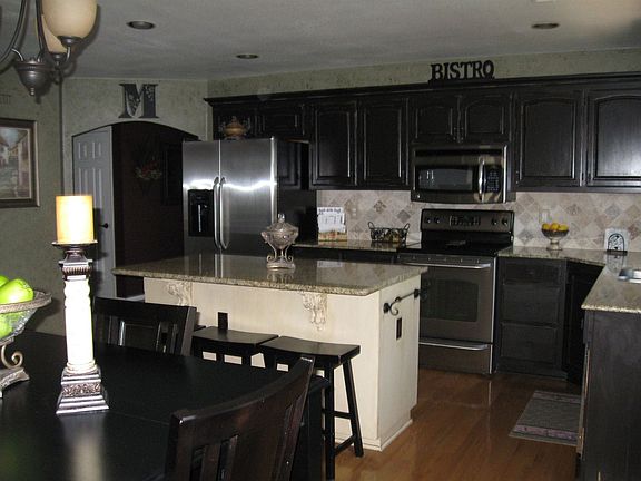 Distressed cabinets and granite countertops