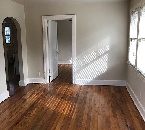 Entry view to living room and master bedroom entry