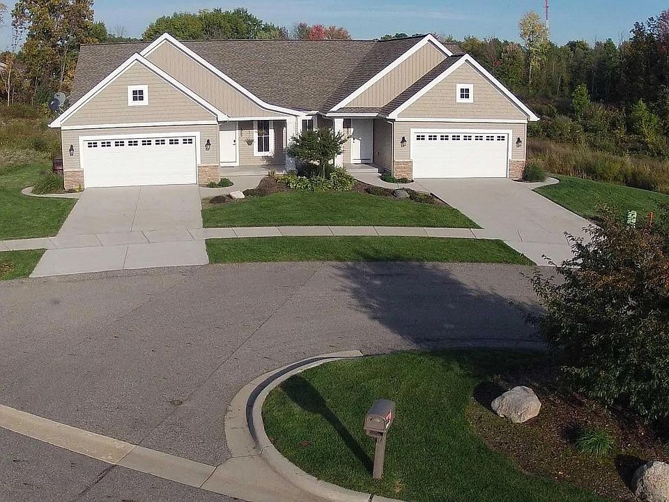 Condo on the right hand with 2 stall garage.