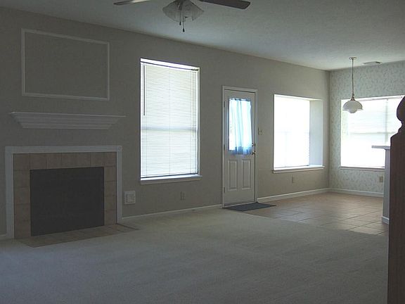 OPEN FAMILY ROOM WITH WOOD BURNING FIREPLACE