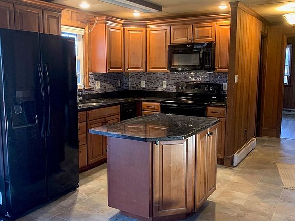 Kitchen and hallway down to bedrooms and bathroom.