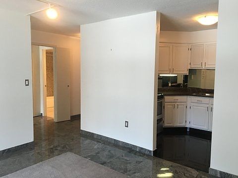 Partial view of kitchen and entry from living room
